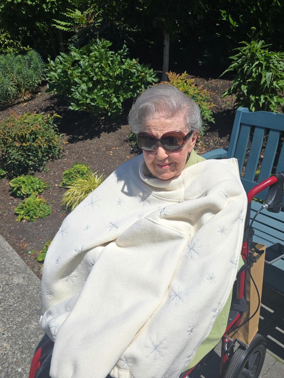A senior customer enjoying a peaceful moment outdoors